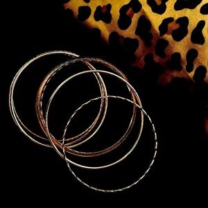 Set of rose gold bangles with delicate designs
